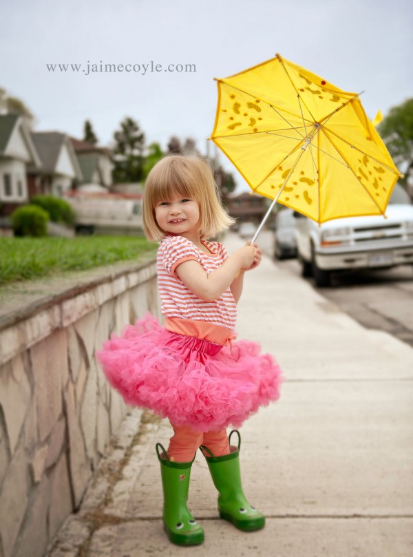 2 year old holding umbrella