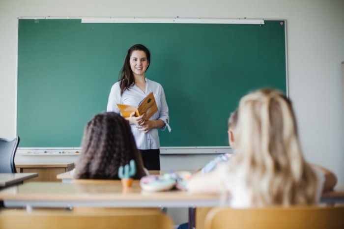 children sitting classroom with teacher 23 2147658992