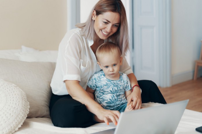 modern woman working with child multi tasking freelance motherhood concept 158595 5049