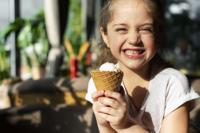 close up happy girl with ice cream