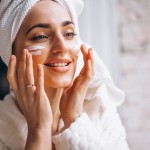 woman applying face cream