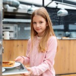 student having lunch canteen