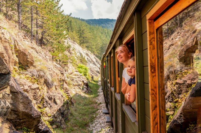 mother her child looking out window train 2