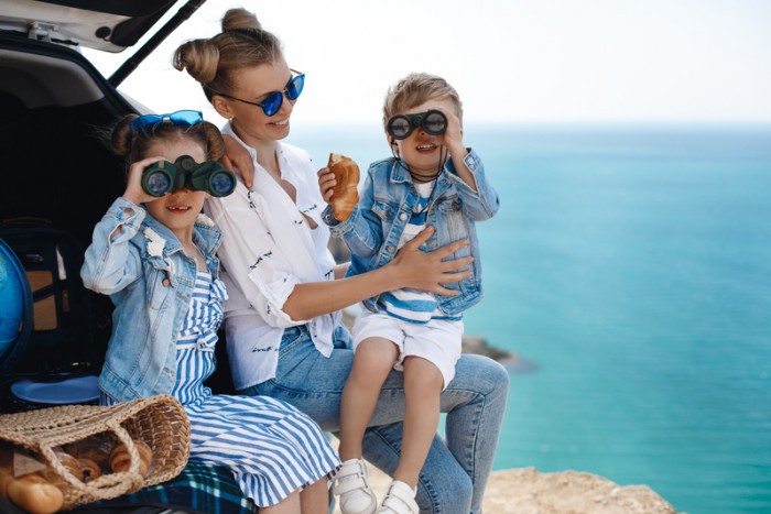 happy beautiful mother kids travel by car near sea 1