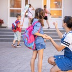 mother accompanies student school happy little girl with caring mom back school