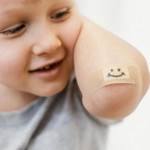 close up kid with smiley patch