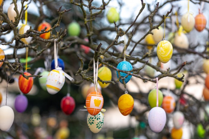 tree decorated with colorful easter eggs street easter decor 1200x800